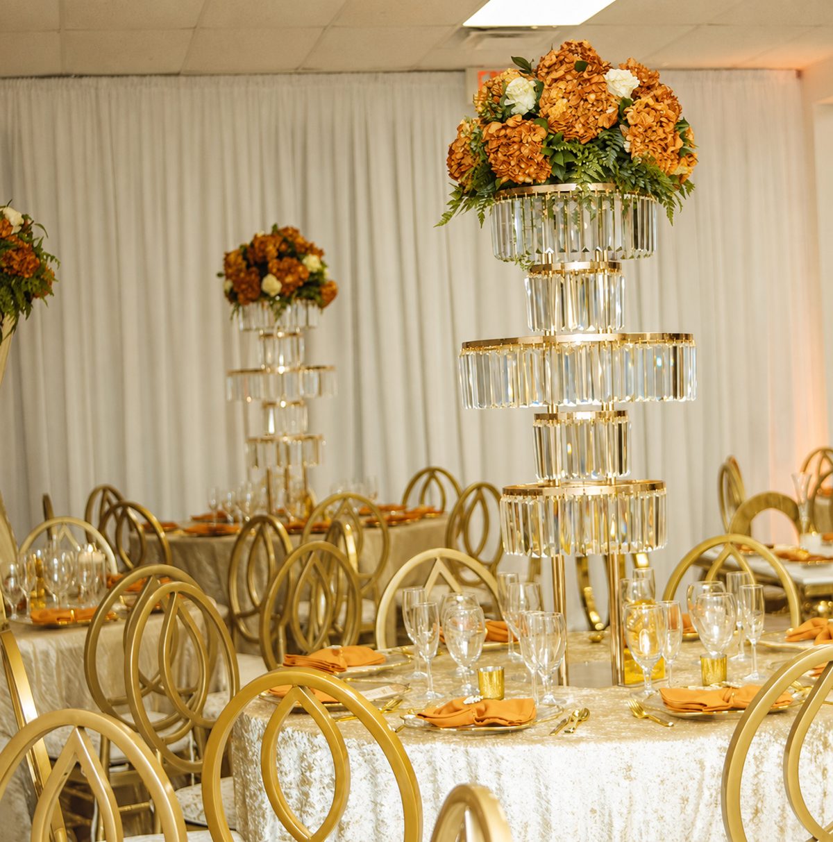 Gold & rust tablescape with crystal tower centerpiece